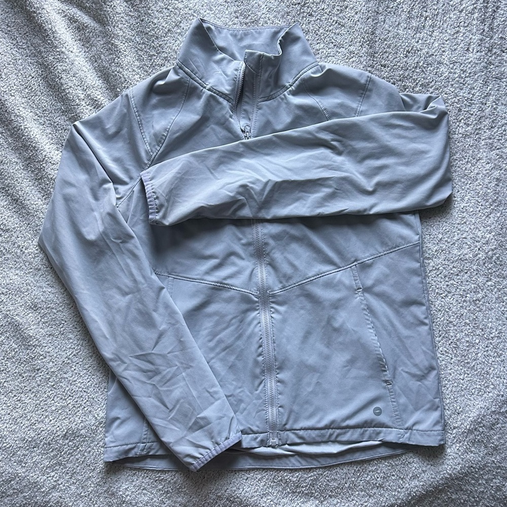 Light grey windbreaker